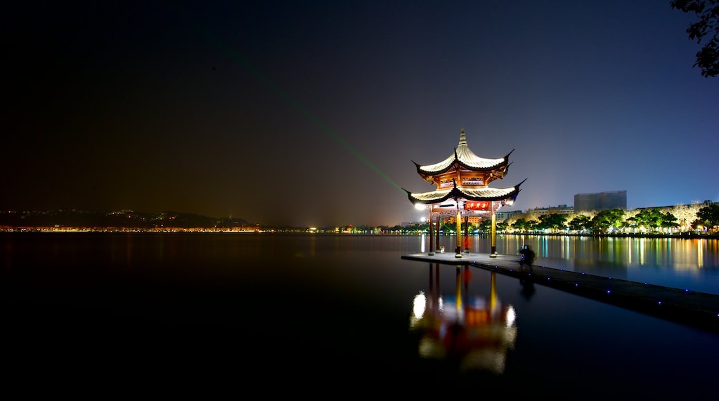 Hangzhou which includes a river or creek and night scenes