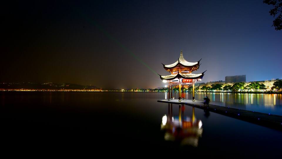 Hangzhou which includes a river or creek and night scenes
