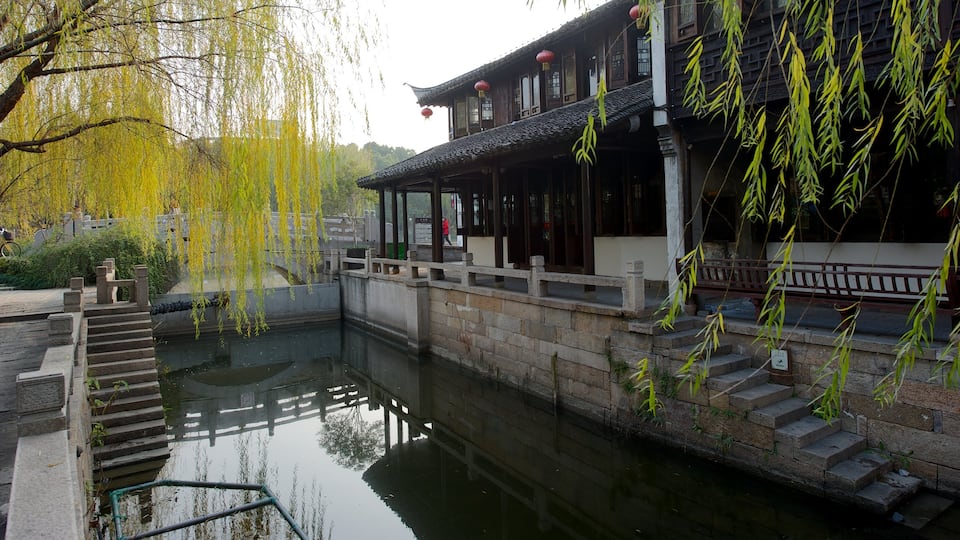 Jiaxing featuring heritage architecture and a pond