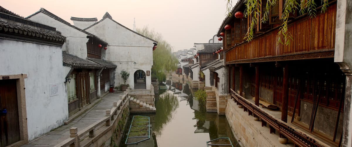 Jiaxing featuring heritage architecture, a small town or village and a river or creek