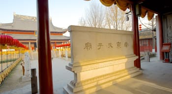 Temple of Confucius which includes religious aspects, signage and a temple or place of worship