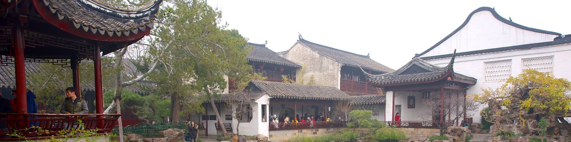 Master of the Nets Garden featuring religious aspects, a pond and a temple or place of worship