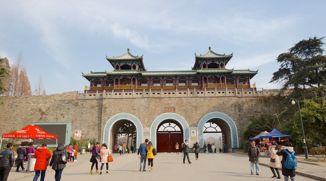 Xuan Wu Lake Park which includes heritage architecture as well as a large group of people