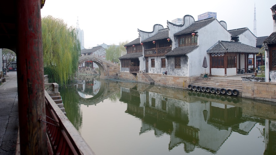 Jiaxing showing a small town or village, a river or creek and heritage architecture