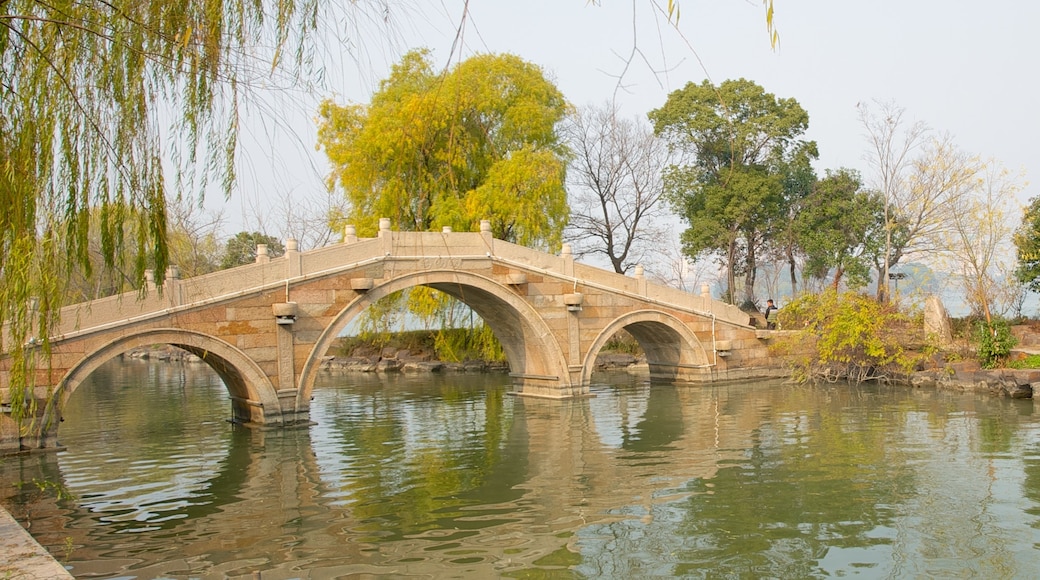 Jiaxing featuring a lake or waterhole and a bridge