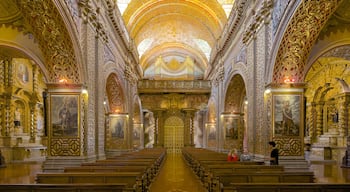 Quito featuring interior views, heritage elements and a church or cathedral