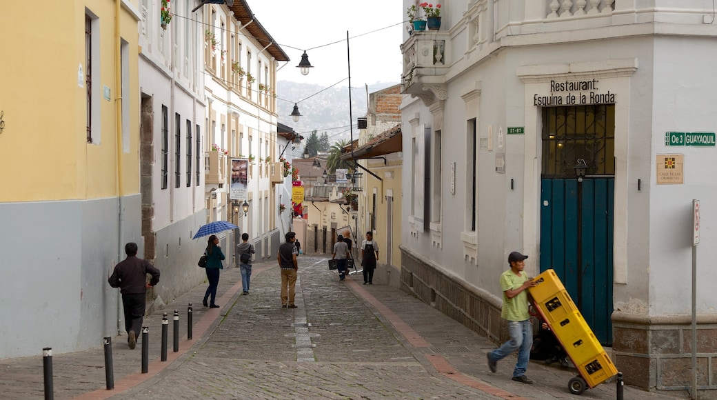 Calle La Ronda featuring street scenes as well as a large group of people