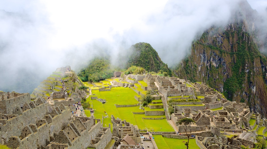 Machu Picchu showing mist or fog and a ruin