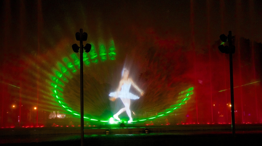 Exposition Park which includes outdoor art, night scenes and a fountain