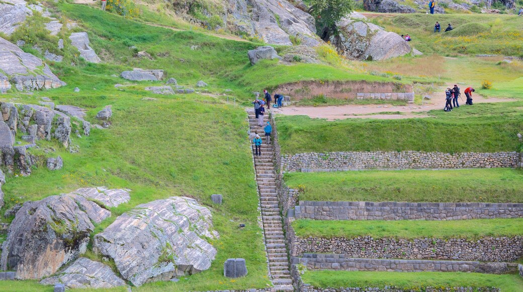 Sacsayhuaman which includes hiking or walking and heritage elements