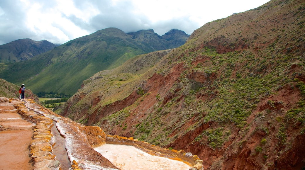 Salt Mines Of Maras featuring mountains and landscape views