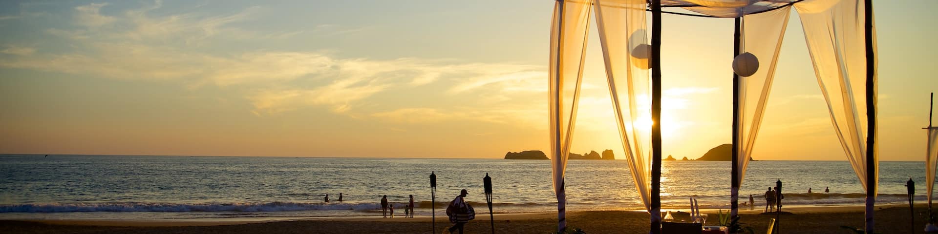 El Palmar Beach which includes tropical scenes, a sunset and a beach
