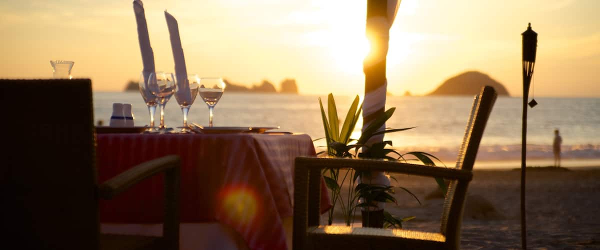 El Palmar Beach featuring a beach, a luxury hotel or resort and a sunset