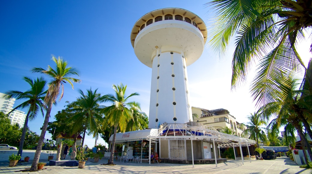 Marina Ixtapa which includes tropical scenes, a city and street scenes