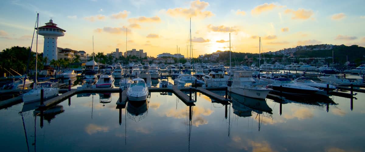 Marina Ixtapa which includes a marina and a sunset