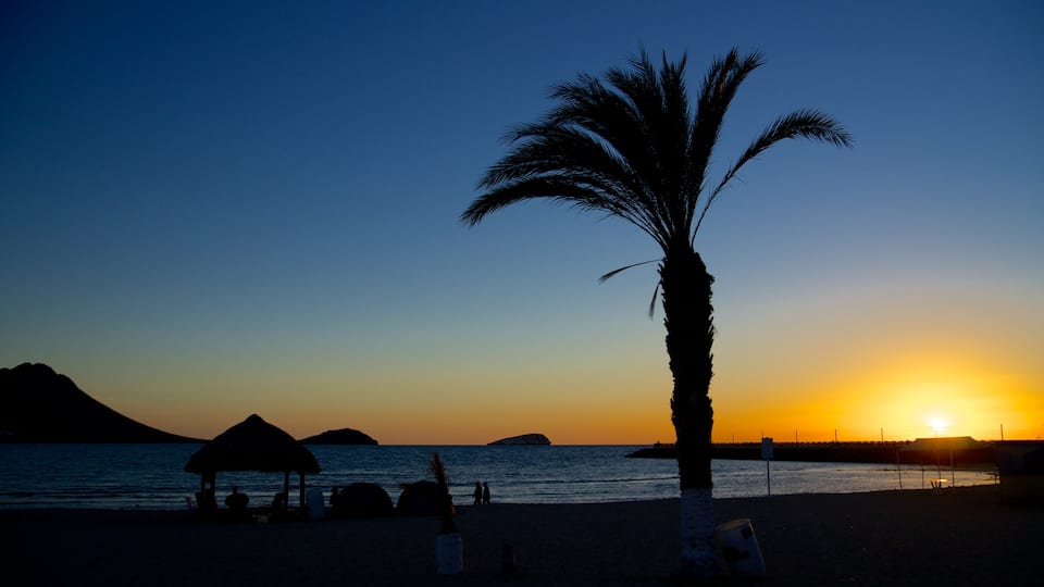 Playa Miramar featuring a sunset, general coastal views and tropical scenes