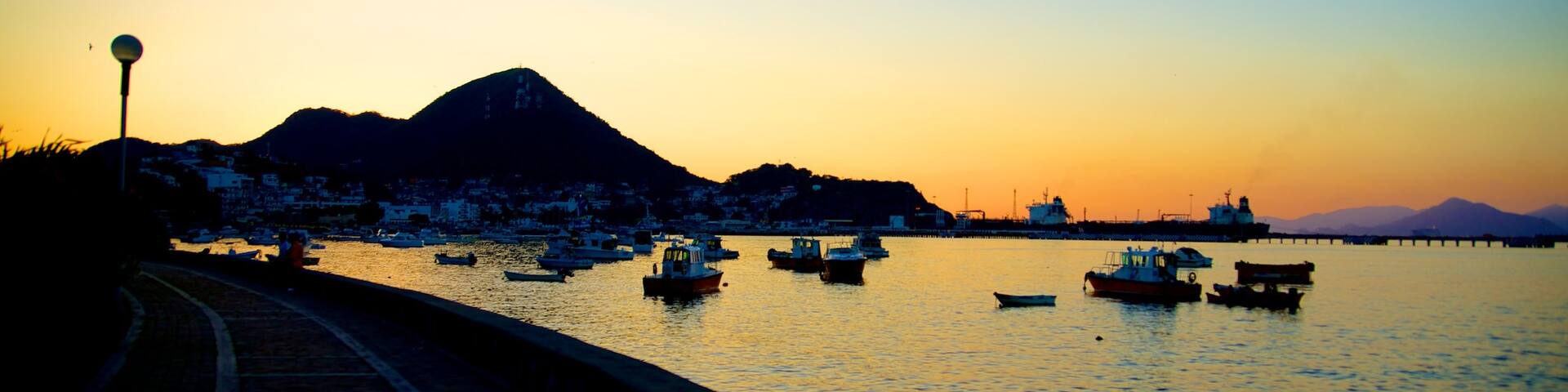 Playa San Pedrito featuring general coastal views, a bay or harbour and a sunset