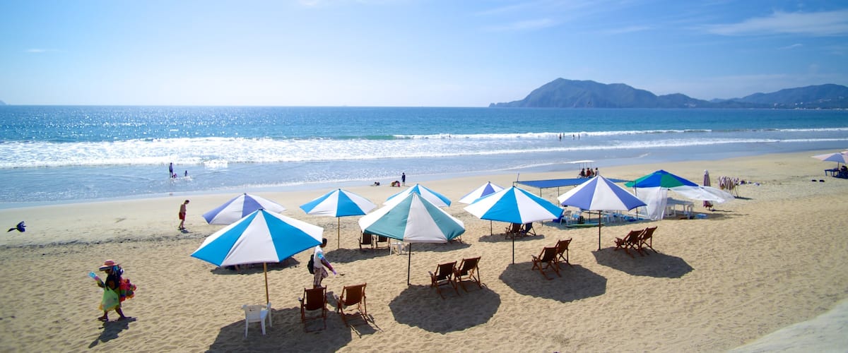 Oro Beach featuring a beach and a luxury hotel or resort