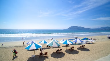 Oro Beach which includes a beach and a luxury hotel or resort