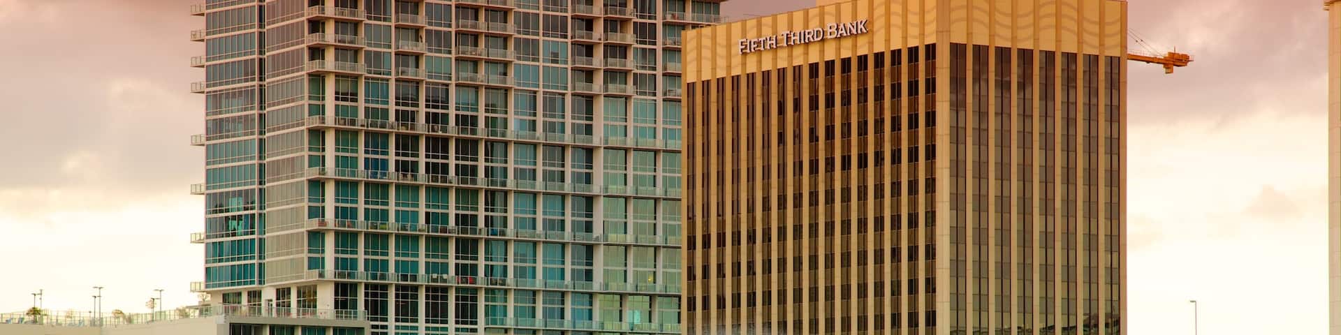 Lake Eola Park which includes a sunset, a lake or waterhole and a city