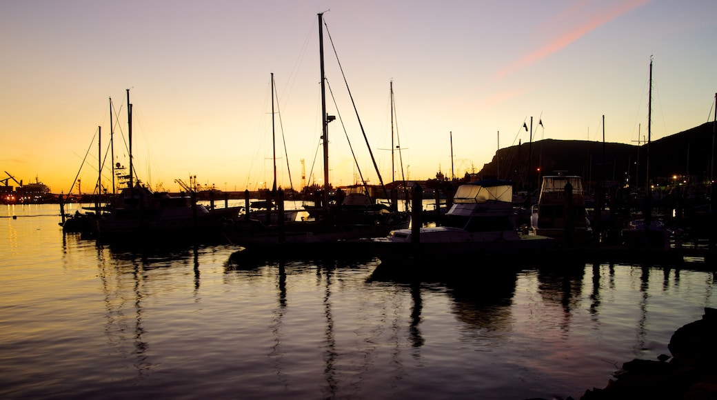 Ensenada which includes a coastal town, a sunset and a marina