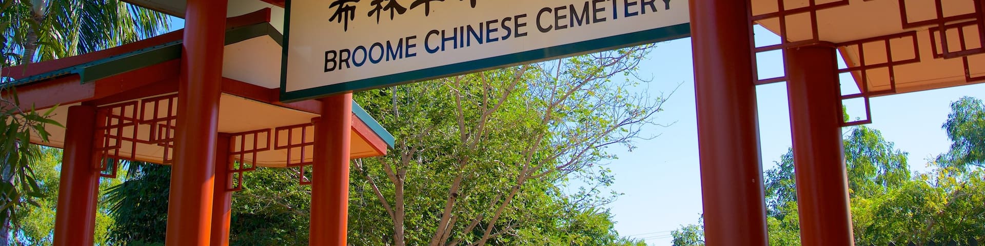 Broome featuring signage, a cemetery and religious elements
