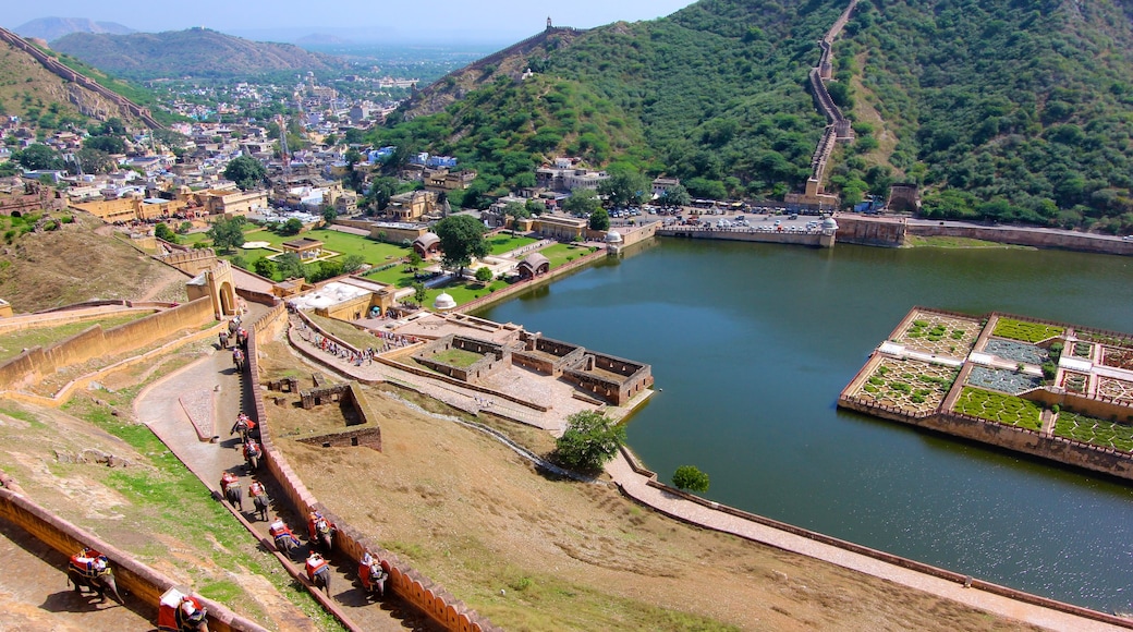 Amber Fort which includes a lake or waterhole, a city and landscape views