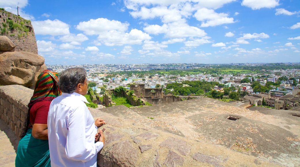 Golconda Fort showing views and a city as well as a couple