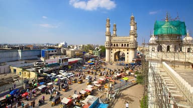 Charminar which includes a square or plaza, a mosque and street scenes