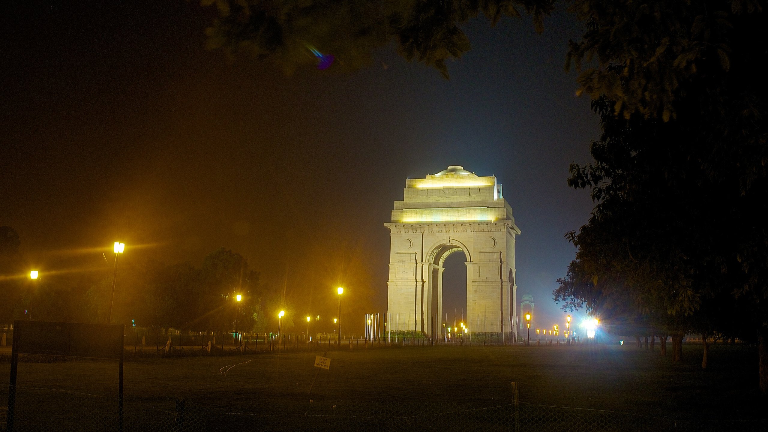 India Gate showing night scenes, a memorial and mist or fog