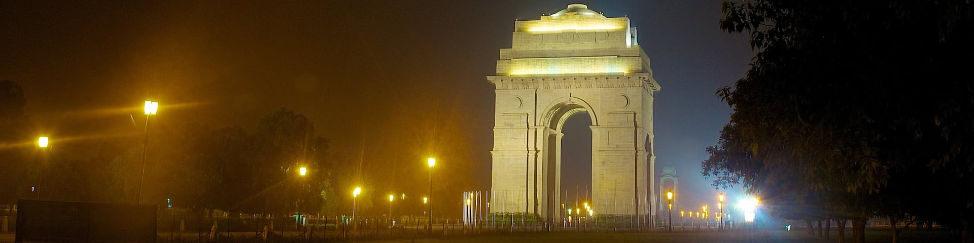 India Gate showing a memorial, mist or fog and night scenes