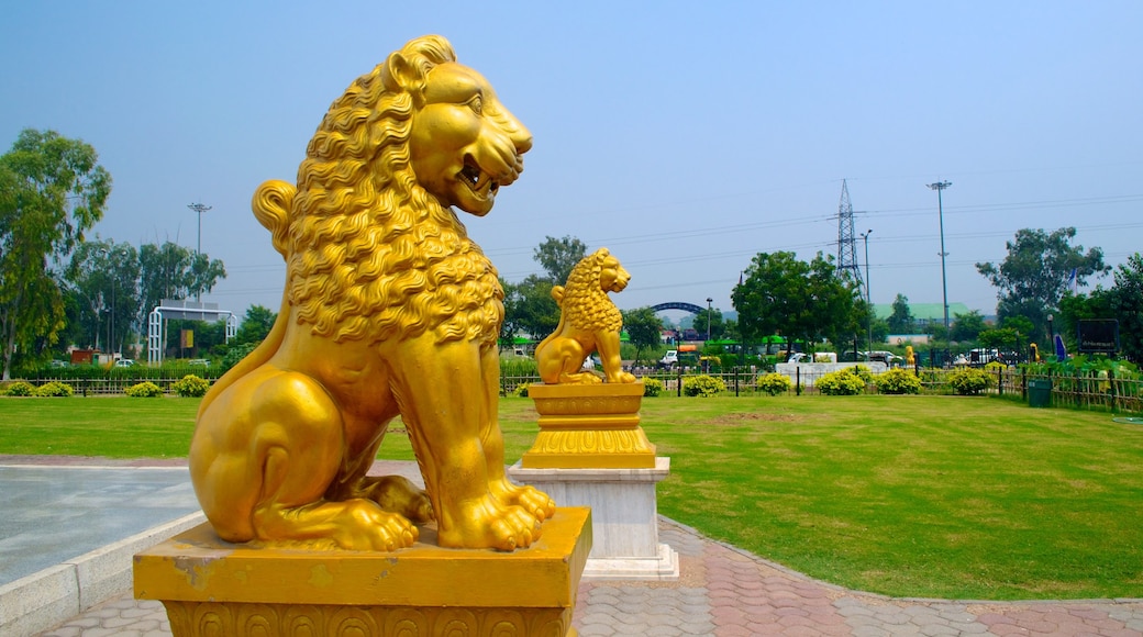 Lotus Temple showing a statue or sculpture, a temple or place of worship and outdoor art