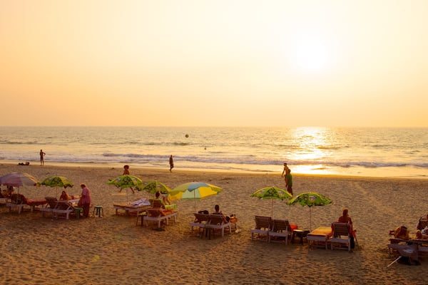 Arambol Beach showing a beach, general coastal views and a sunset