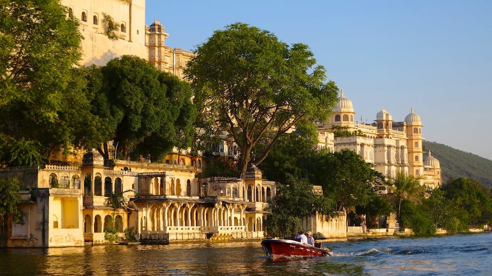 City Palace featuring a lake or waterhole and a castle