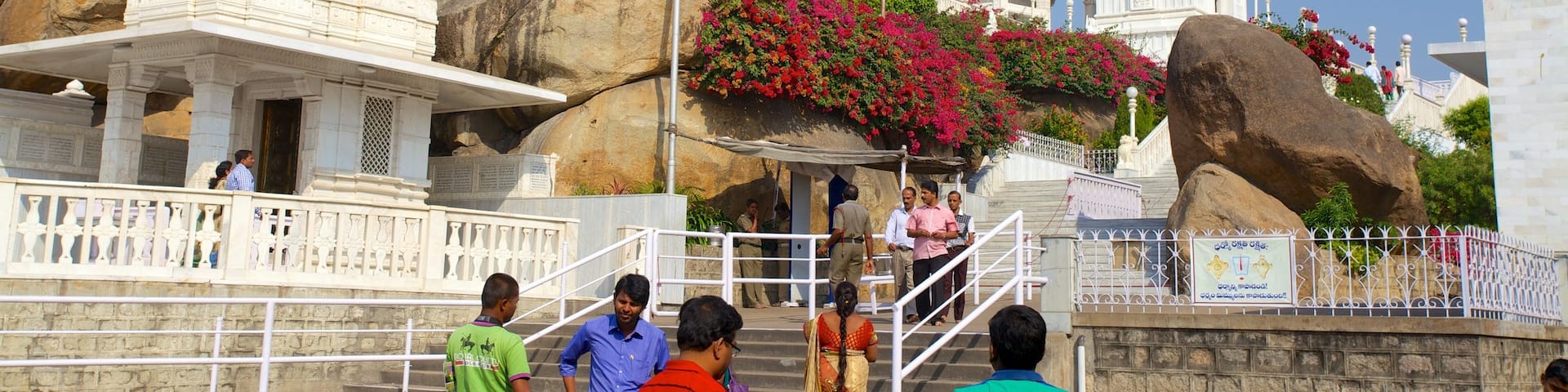 Birla Mandir Temple featuring a temple or place of worship as well as a large group of people