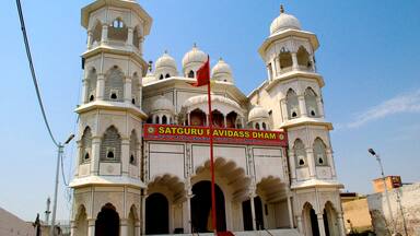 Shri Guru Ravidas Mandir Chak Hakim featuring heritage architecture and a city