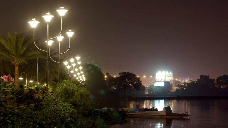 Kolkata featuring a lake or waterhole, a city and night scenes