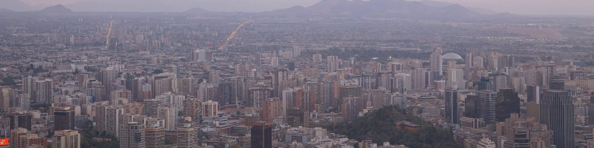 San Cristobal Hill showing a city and a sunset