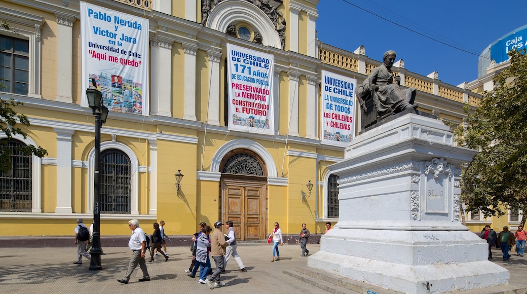 University of Chile which includes a statue or sculpture and street scenes as well as a large group of people