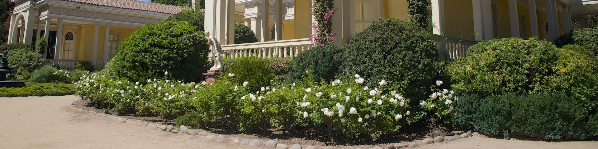 Concha Y Toro Winery which includes heritage architecture and flowers