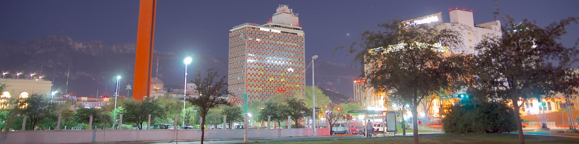 Faro de Comercio showing night scenes, central business district and a monument
