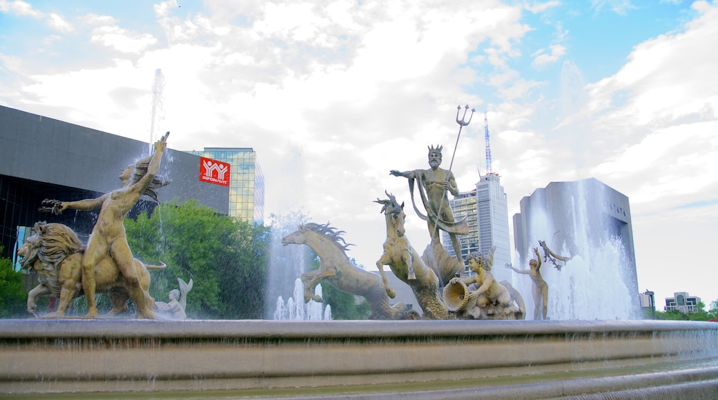 Fuente de la Vida o Neptuno showing a city, a fountain and art