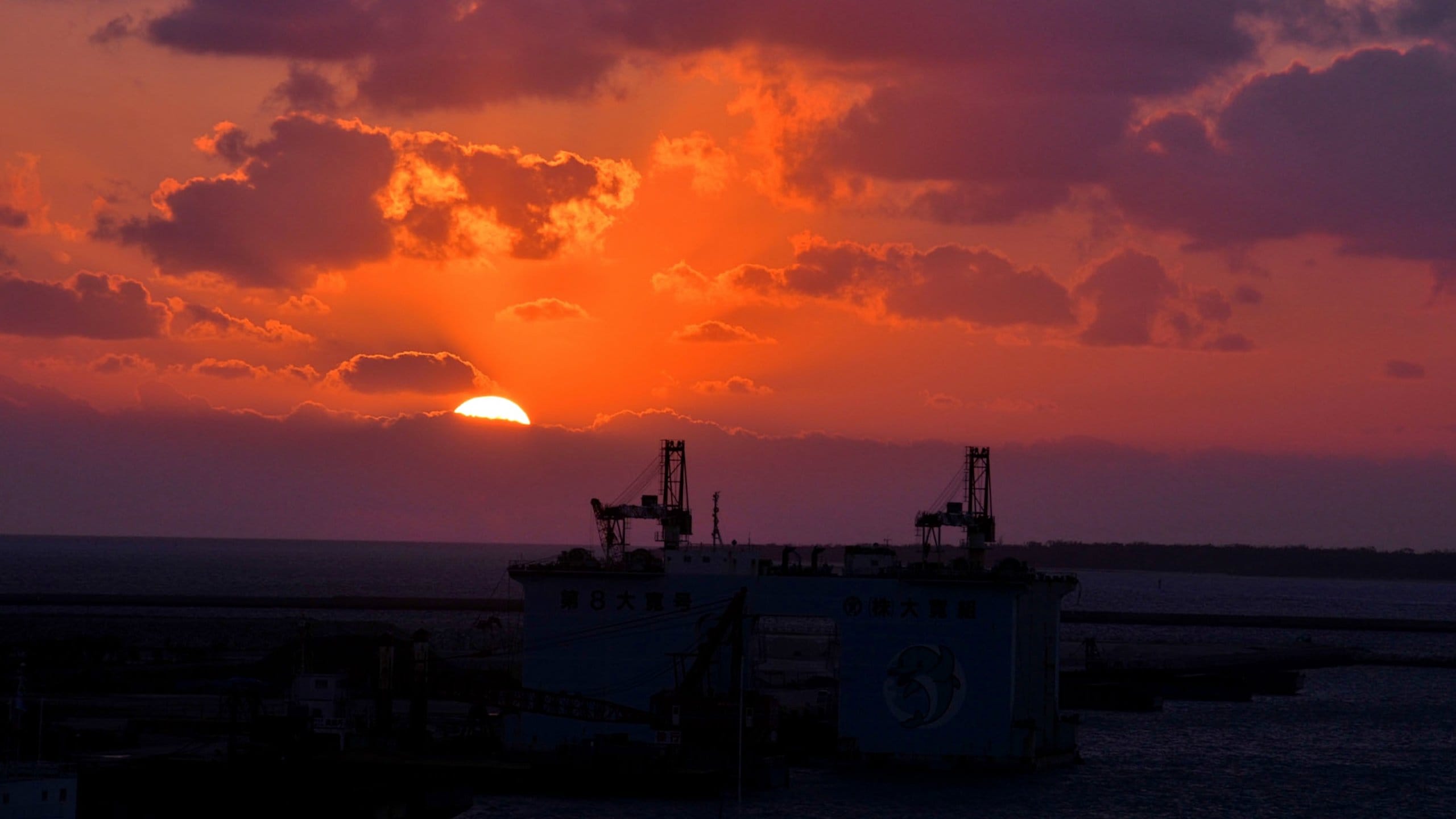 Okinawa featuring night scenes, boating and a sunset