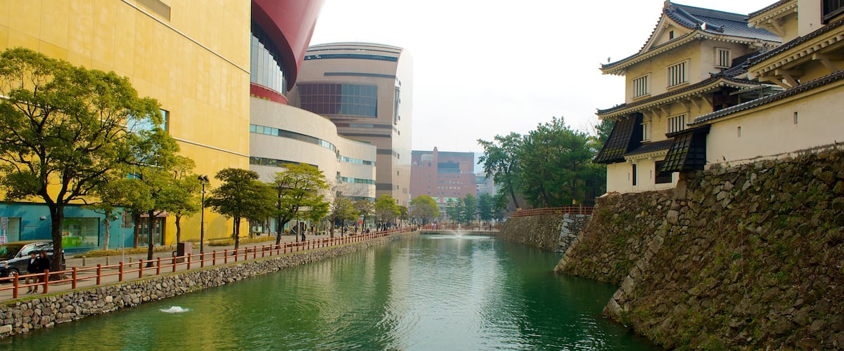 Kitakyushu mettant en vedette rivière ou ruisseau, quartier d\'affaires et petite ville ou village