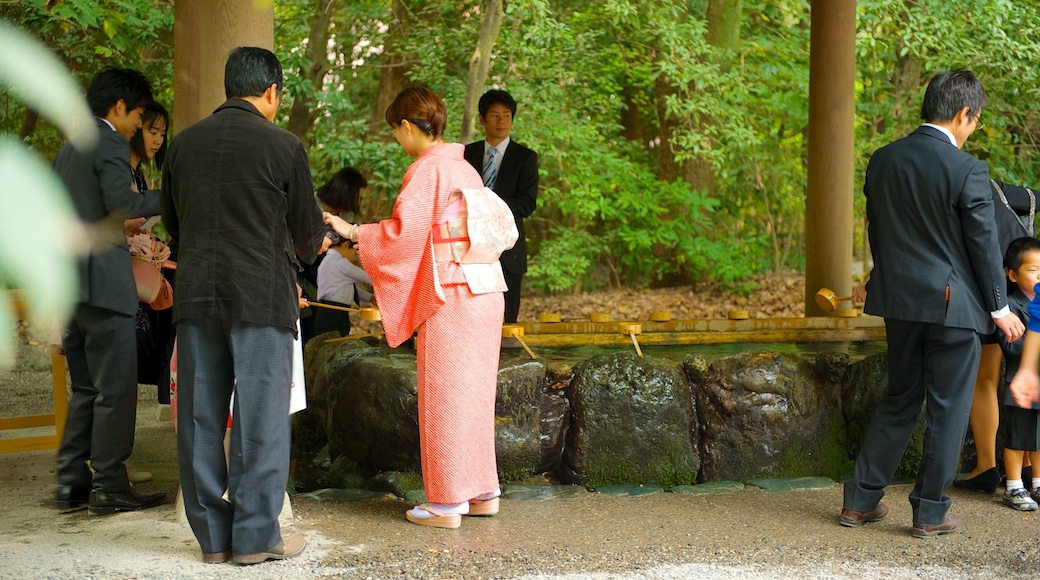 Atsuta Shrine which includes religious elements and a temple or place of worship as well as a large group of people