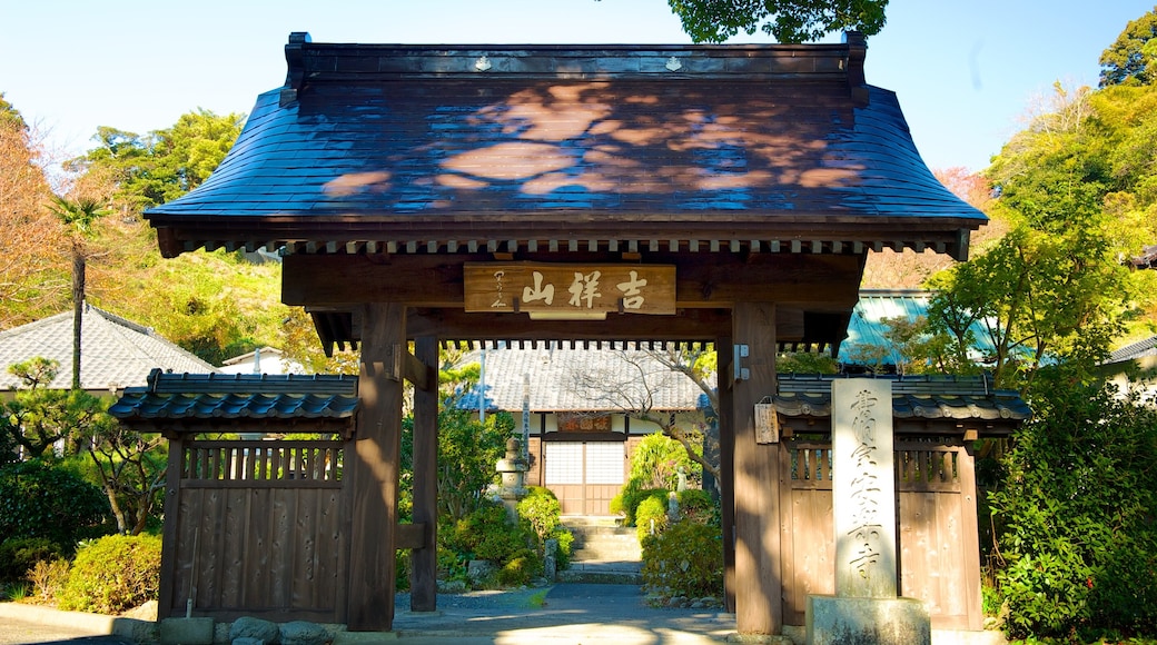 Anrakuji Temple showing a garden, a temple or place of worship and signage