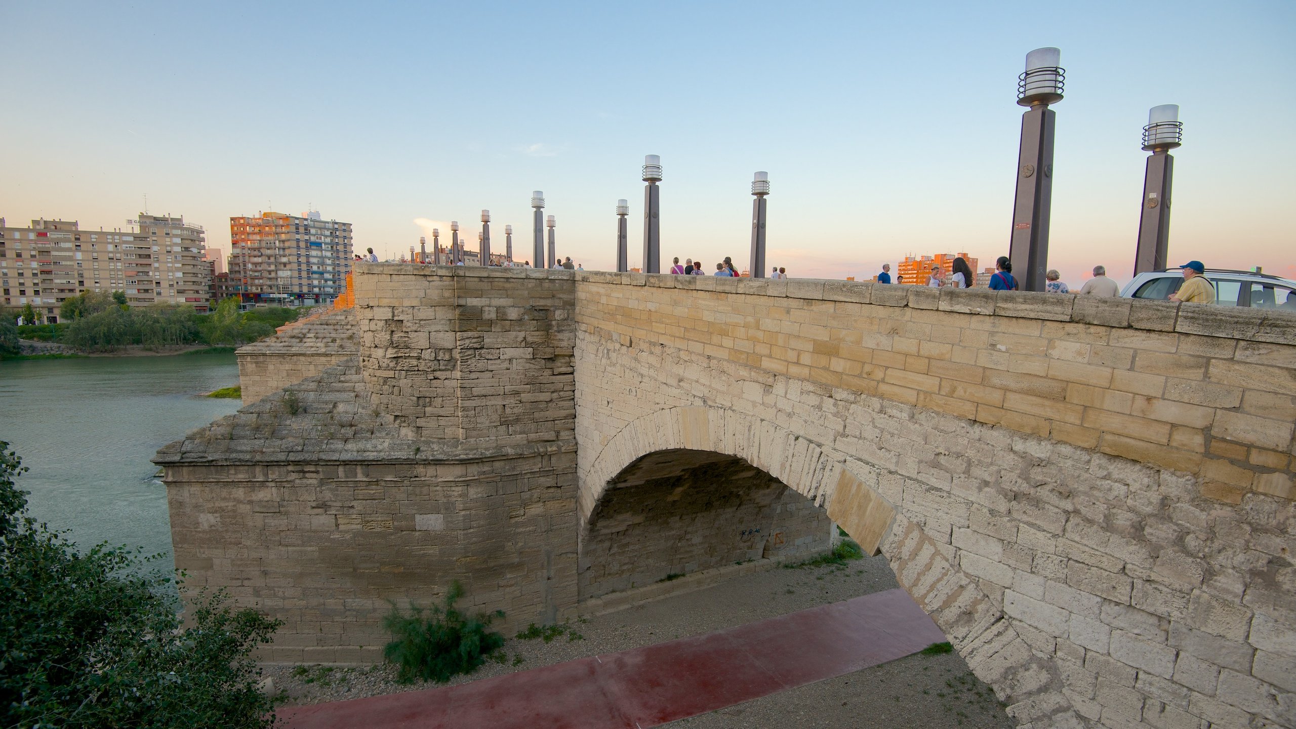 Puente de Piedra showing a bridge, a city and a river or creek