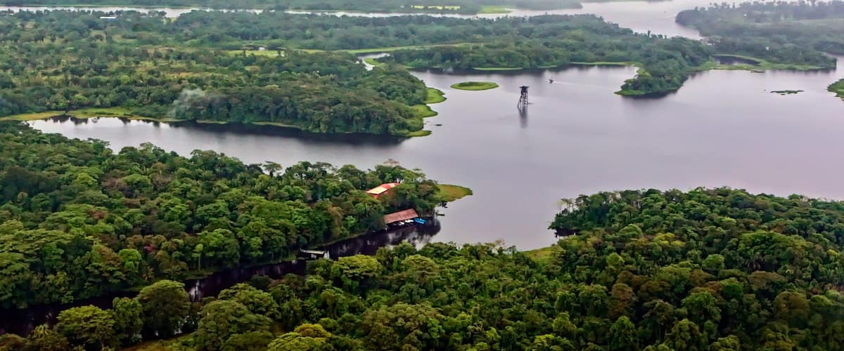 Rio San Juan which includes forest scenes and a river or creek