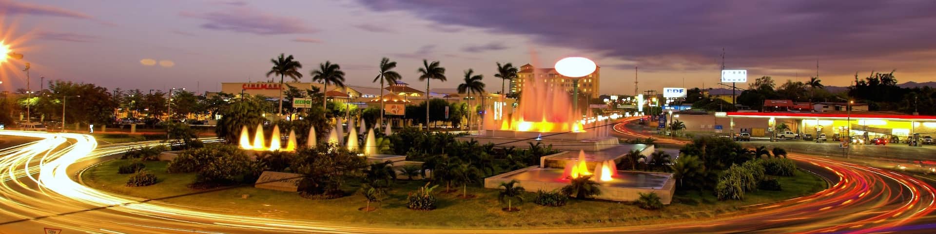 Managua which includes a city and a sunset