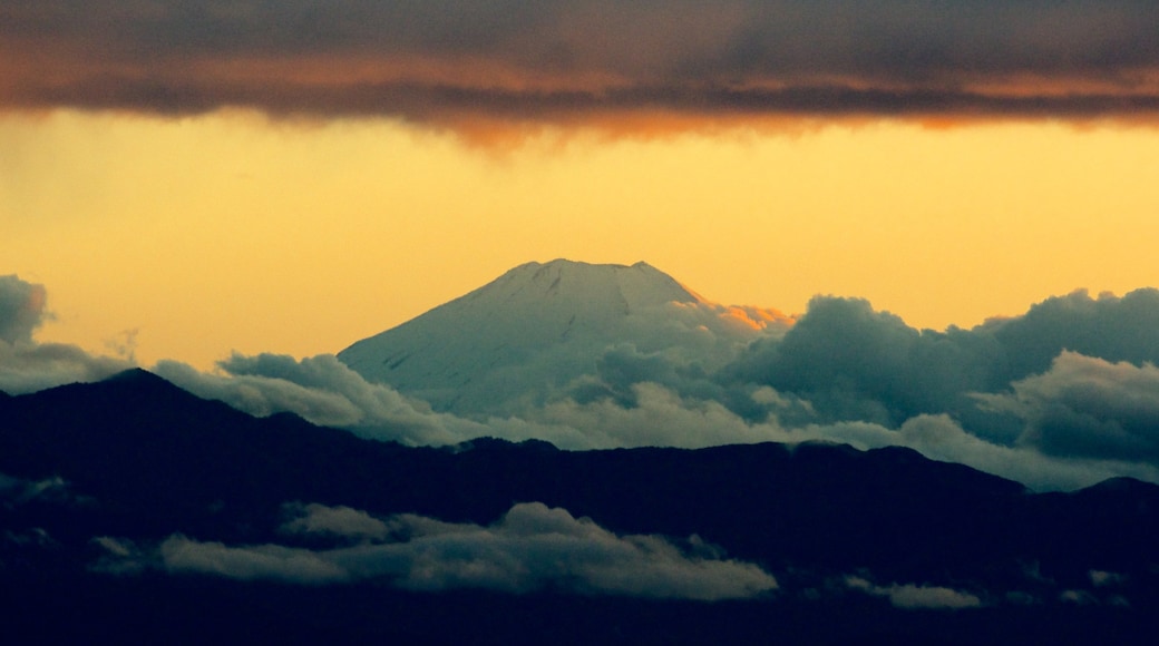 Mount Fuji which includes mist or fog, a sunset and landscape views